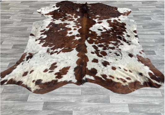 Brown and White Cowhide Rug