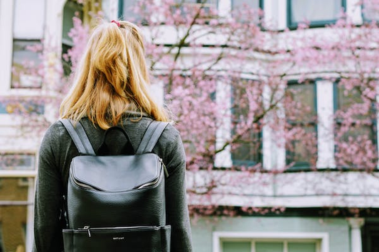 a woman carrying a backpack