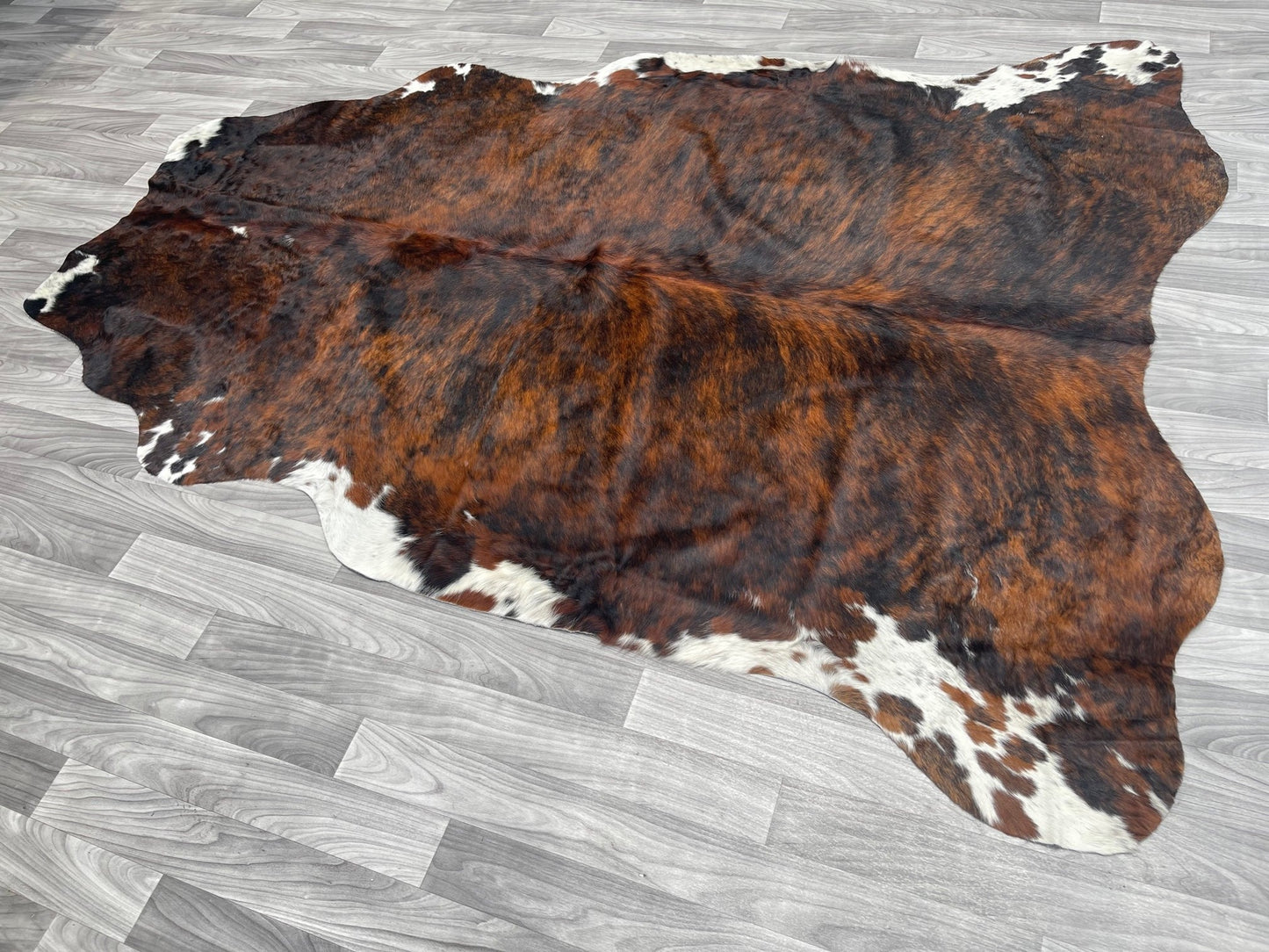 Cowhide Rug v 196 red brindle