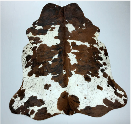 A White and Brown Cowhide Rug