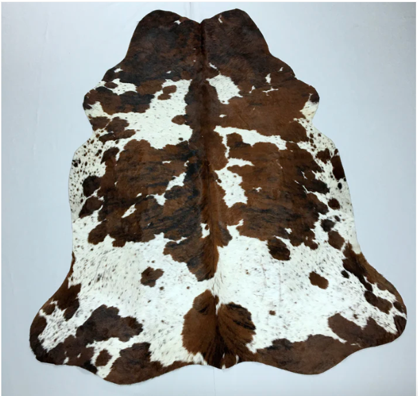 A White and Brown Cowhide Rug