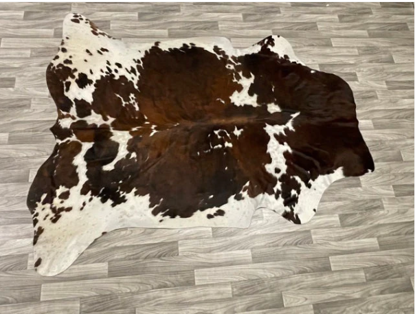 A Brown and White Cowhide Rug