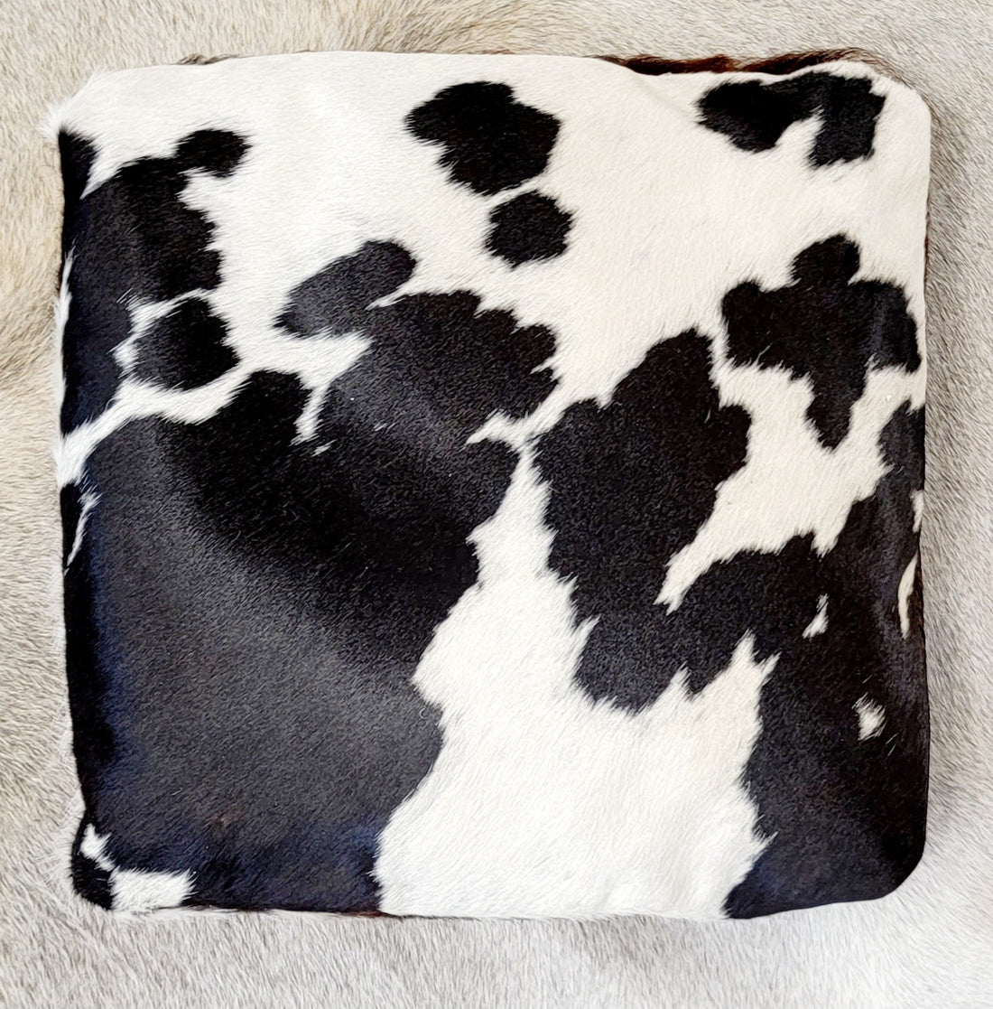 dual toned cowhide pillow